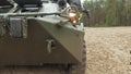 Soldiers in camouflage with combat weapons in the forest near the battle car, military concept