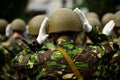 Soldiers in camouflage uniform arranging their helmets