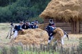 Soldiers carry hays