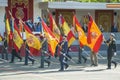 Soldiers carrying regimental Spanish flag saluting King Felipe VI during the National Day military parade in Madrid Spain Royalty Free Stock Photo