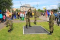 Soldiers-contract employees carry out power exercises with weights