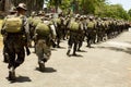 Soldiers in full combat gear running