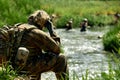 Soldiers game on military training ground, battle camp. Action. Operation Trainer giving training to military soldiers Royalty Free Stock Photo