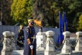 Soldiers guard the eternal flame for the army heroes during a military ceremony in Bucharest, Romania, at the Tomb of the Unknown