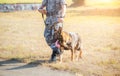 Soldiers from the K-9 unit demonstrations to attack the enemy , the green lawns. learn the human language. Dogs can follow orders