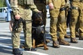 Soldiers of KORD police special forces, and police dog standing in the line on the ground Royalty Free Stock Photo