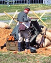 Soldiers load a cannon. Mincer Nivelle battle reenactment