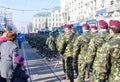 Soldiers in military green uniform marching and celebrating