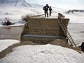 Soldiers searching a bridge in Afghanistan
