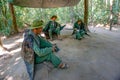 Soldiers sitting under a canopy. Installation of the American Vietnam war near the Cu Chi tun Royalty Free Stock Photo