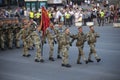 Soldiers of Special forces marching, officers carrying flag. Military parade Royalty Free Stock Photo