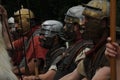 Roman soldiers stand at attention in a medieval reenactment