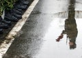 Soldiers stand on wet pavement army