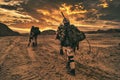 Soldiers walking on in the wilderness in the sunset