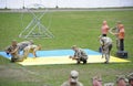 Soldiers washing the wrestling mat preparing it for competition