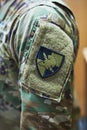 Soldiers wear their feelings on their sleeves. a soldier wearing camouflage fatigues with a patch attached to velcro on