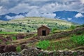Mud house in the green volcanic landscape of the crater Maragua in the Cordillera close to Sucre, Bolivia