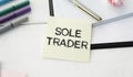 SOLE TRADER, text on white notepad on craft Royalty Free Stock Photo
