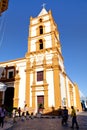 The Soledad church in Camaguey. Some People walk on the street in front of the church