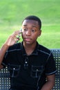 Black Teen Boy Talking on his cell phone Royalty Free Stock Photo