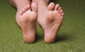 soles of feet of barefoot female person