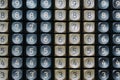 A solid background of numbers on the plastic buttons of an outdated calculator. Texture of numbers. Numerology and