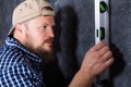 Solid bearded foreman with a plumb studio portrait.