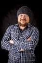 Solid bearded man in a wool cap portrait