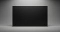 Solid Black Rectangular Displayed Centered on a Softly Lit Gray Gradient Background with Subtle Spotlight Royalty Free Stock Photo