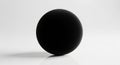 A solid black sphere positioned centrally on a minimalist white background. The sphere\'s surface is Royalty Free Stock Photo