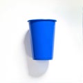 A solid blue plastic cup isolated on a white background, great for event planning, party themes, or graphic design resources Royalty Free Stock Photo