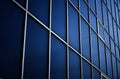 Solid blue windows of the office building. Glass wall Royalty Free Stock Photo