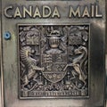 Solid bronze vintage Canada Post mailbox with Canadian Coat of Arms Royalty Free Stock Photo