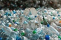 Solid carpet of plastic bottles with a white recycling symbol