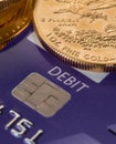 Gold coins on chip and pin debit card Royalty Free Stock Photo