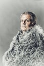 Solid middle-aged man in a fur mantle Royalty Free Stock Photo