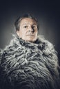 Solid middle-aged man in a fur mantle Royalty Free Stock Photo