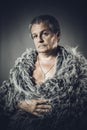 Solid middle-aged man in a fur mantle Royalty Free Stock Photo