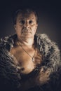 Solid middle-aged man in a fur mantle Royalty Free Stock Photo