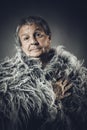 Solid middle-aged man in a fur mantle Royalty Free Stock Photo