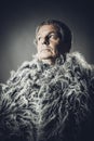 Solid middle-aged man in a fur mantle Royalty Free Stock Photo