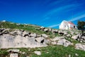 Solid mountain lodge on top of a rocky ridge