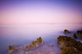 Solid rocks and a beautiful ocean at dusk