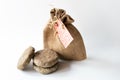 Solid shampoo discs close up with jute bag example of natural and ecological plastic free cosmetic, homemade with herbs