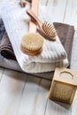 Solid soap, body brush, hairbrush and towels for green bath Royalty Free Stock Photo