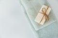 Solid soap corded on bath towels on white background with copy space. Top view with copy space Royalty Free Stock Photo