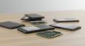 Solid-state drives (SSDs) and a visible RAM module are spread across a light wooden Royalty Free Stock Photo