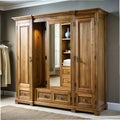 Solid wood wardrobe with mirrored doors and hidden compartments Royalty Free Stock Photo