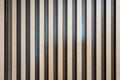 Solid wooden battens wall pattern background with natural color finishing Royalty Free Stock Photo