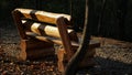 Solid wooden bench at Sticlarie Park in Bucharest Royalty Free Stock Photo